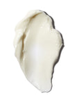 closeup of smear of cream-colored skincare night cream, on white background 