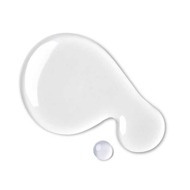 closeup of two droplets of clear lactic acid facial essence, on white background
